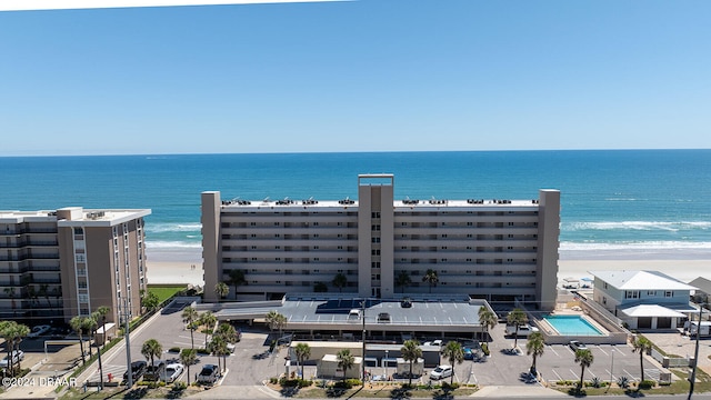 bird's eye view with a water view and a view of the beach