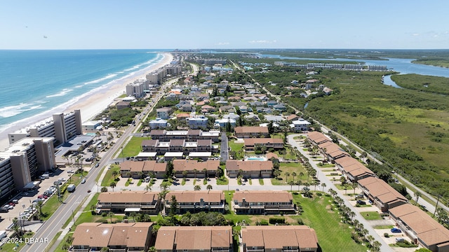 birds eye view of property featuring a view of the beach and a water view