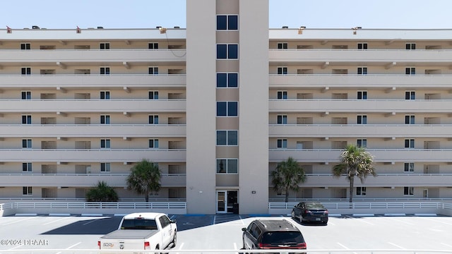 4453 S Atlantic Ave Unit 1080, Ponce Inlet, FL 32127 - view of apartment building / complex with uncovered parking