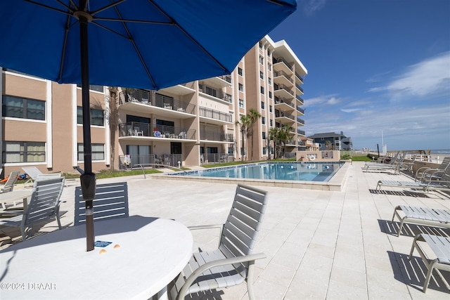 view of pool featuring a patio