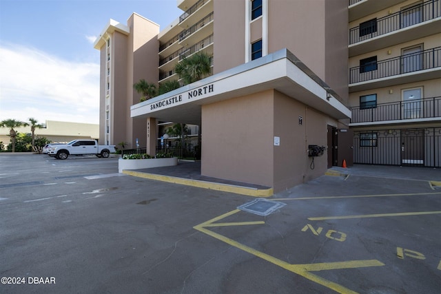 4435 S Atlantic Ave Unit 414, Ponce Inlet, FL 32127 - view of building exterior with uncovered parking