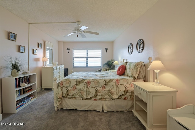 bedroom featuring a textured ceiling, ceiling fan, and dark carpet