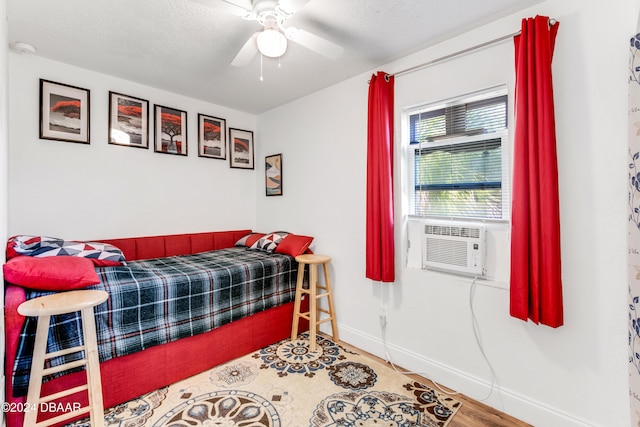 545 Cannon St, Daytona Beach, FL 32114 - bedroom with baseboards, cooling unit, and a ceiling fan