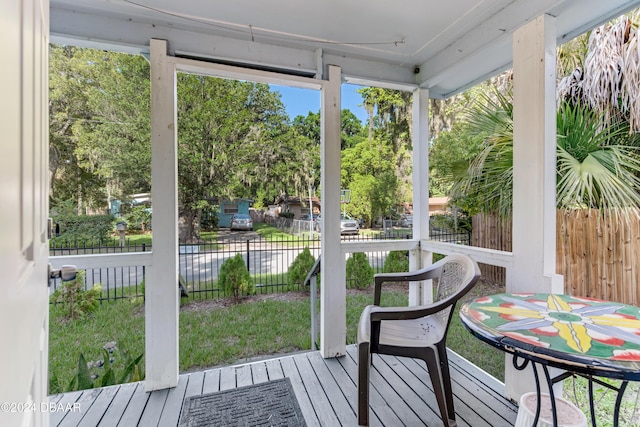 545 Cannon St, Daytona Beach, FL 32114 - sunroom featuring view of wooded area