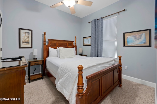 bedroom with ceiling fan and light colored carpet