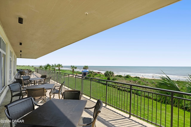 balcony with a view of the beach and a water view