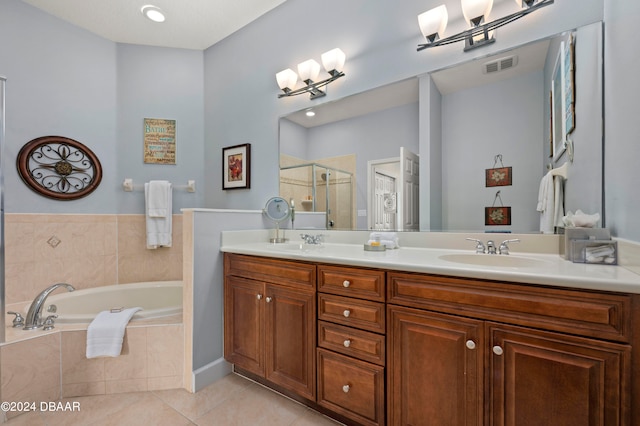 bathroom featuring vanity, tile patterned floors, and shower with separate bathtub