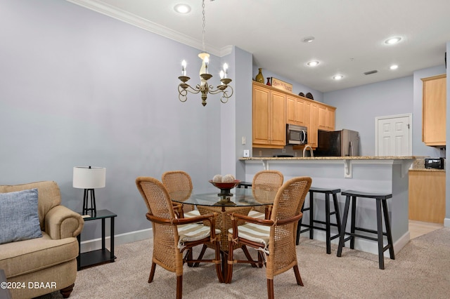 dining area featuring light colored carpet, ornamental molding, and a notable chandelier