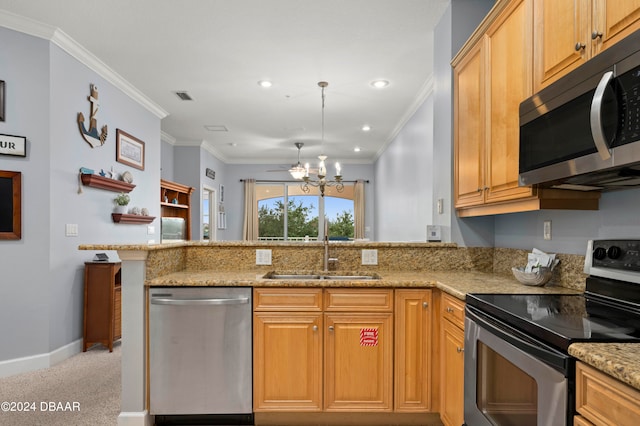 kitchen with stainless steel appliances, light stone counters, kitchen peninsula, sink, and crown molding