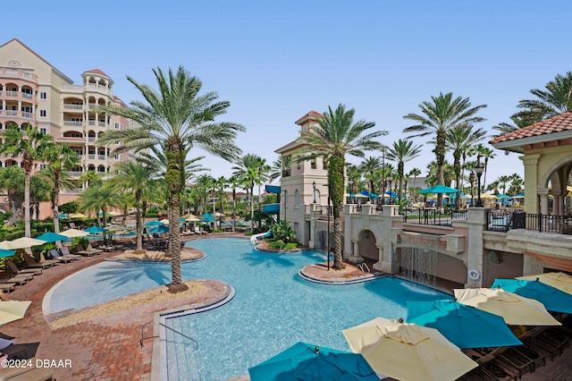 view of pool with pool water feature