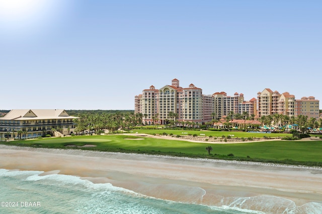 exterior space featuring a water view and a beach view