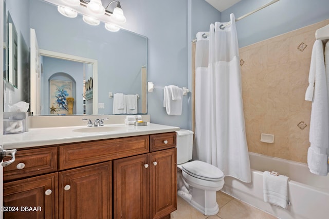 full bathroom featuring toilet, vanity, tile patterned floors, and shower / tub combo with curtain