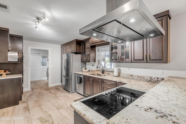 kitchen with sink, stainless steel appliances, dark brown cabinetry, island range hood, and a textured ceiling