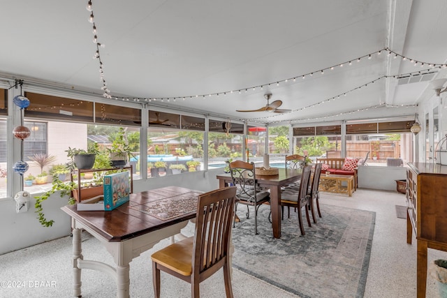 sunroom / solarium featuring ceiling fan