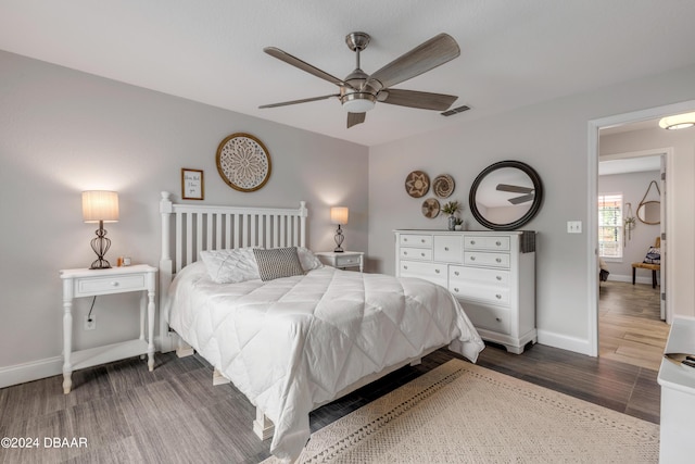 bedroom featuring ceiling fan and dark hardwood / wood-style flooring