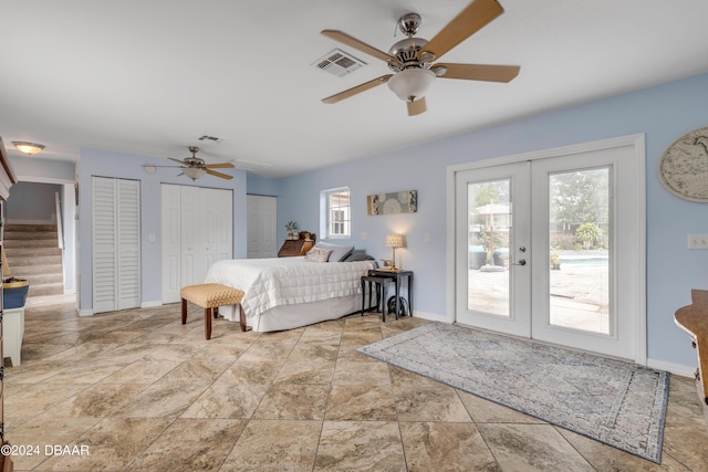 bedroom with multiple windows, access to exterior, two closets, and french doors