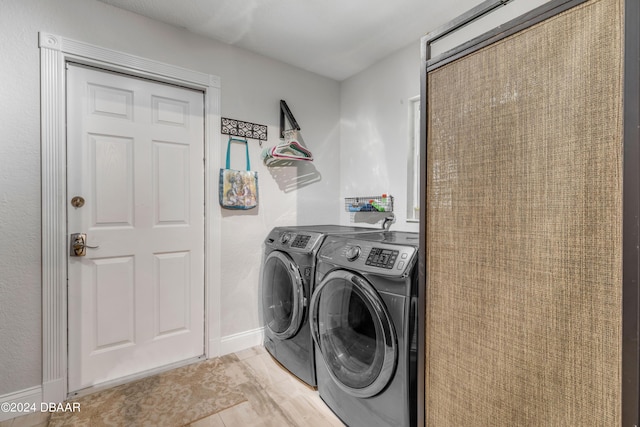 laundry room with washing machine and clothes dryer