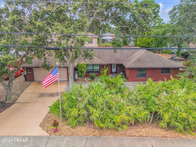 single story home with a garage