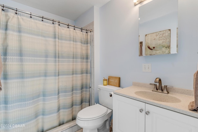 bathroom featuring vanity, toilet, and a shower with shower curtain