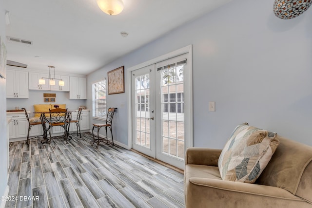 interior space featuring french doors and light wood-type flooring