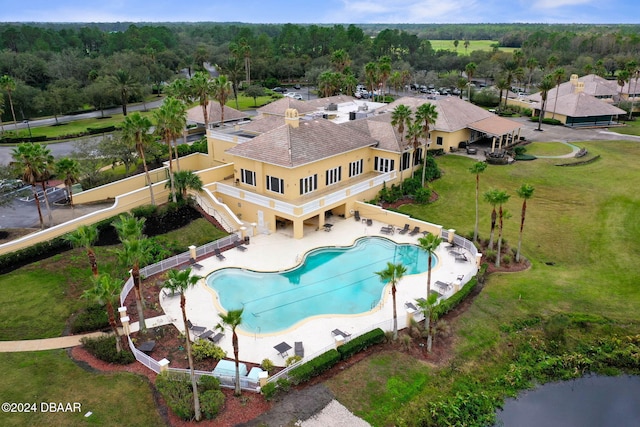 118 Pitching Wedge Dr, Daytona Beach, FL 32124 - view of subject property with a pool and a heavily wooded area
