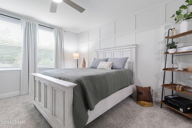 bedroom featuring ceiling fan and light colored carpet