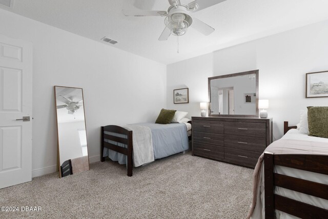 118 Pitching Wedge Dr, Daytona Beach, FL 32124 - bedroom featuring light colored carpet and a ceiling fan
