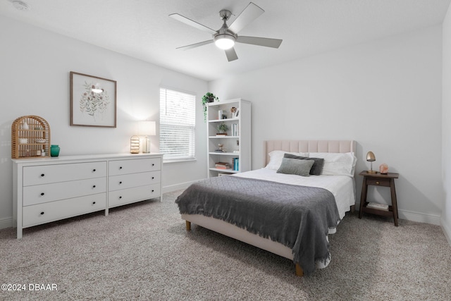 bedroom featuring ceiling fan and light colored carpet