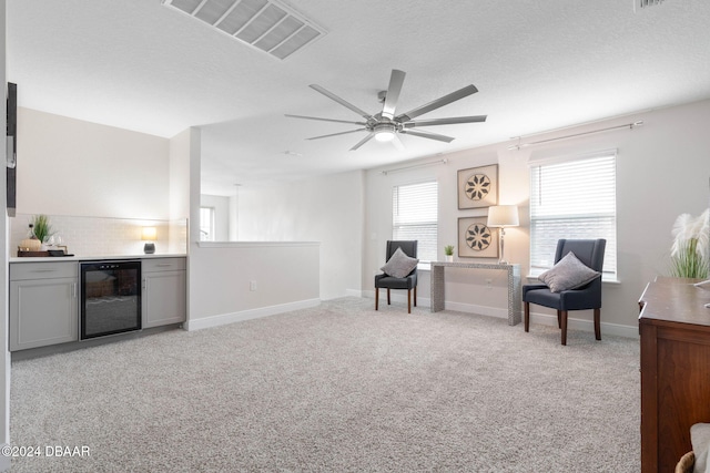 118 Pitching Wedge Dr, Daytona Beach, FL 32124 - living area featuring wine cooler, light carpet, and ceiling fan
