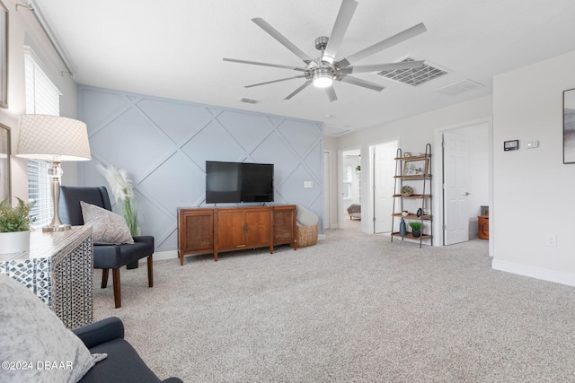 living room featuring light carpet and ceiling fan