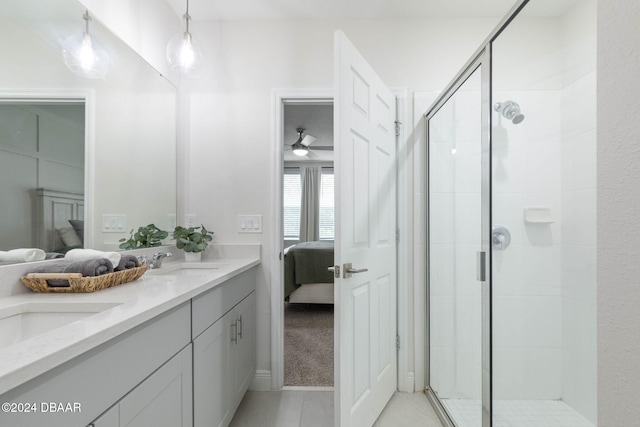 bathroom featuring vanity, ceiling fan, and walk in shower