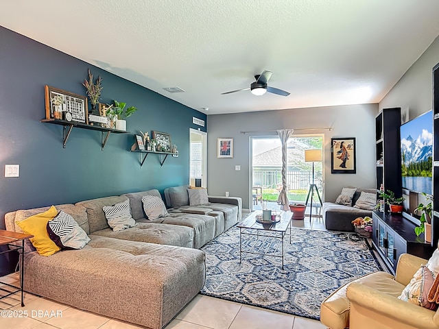 330 Charles Dr, Deland, FL 32724 - tiled living area featuring a ceiling fan and a textured ceiling