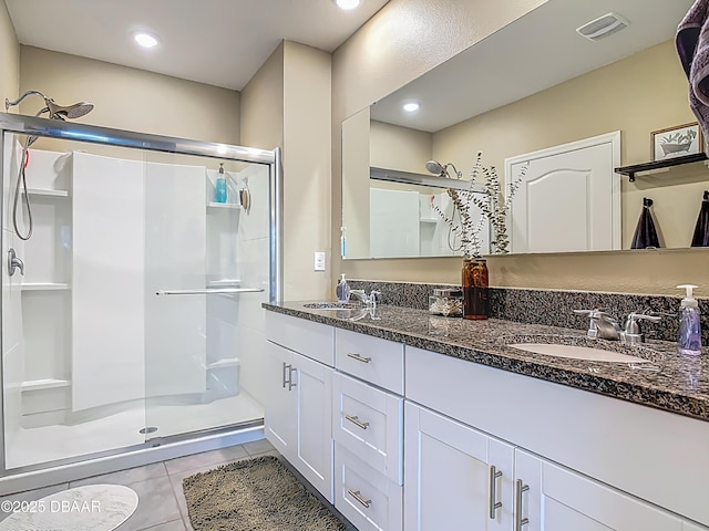 330 Charles Dr, Deland, FL 32724 - bathroom featuring a shower stall, tile patterned floors, and double vanity