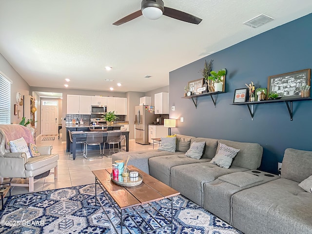 330 Charles Dr, Deland, FL 32724 - living area featuring ceiling fan, light tile patterned floors, recessed lighting, and a textured ceiling