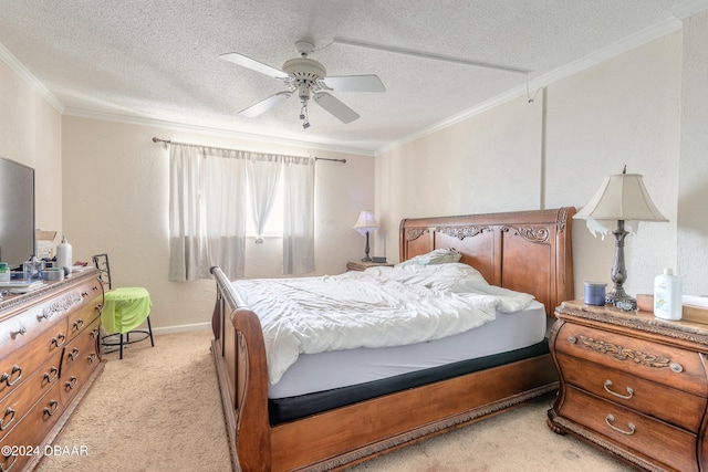 carpeted bedroom featuring ceiling fan, a textured ceiling, and crown molding