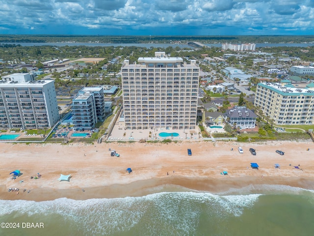 aerial view featuring a view of the beach and a water view