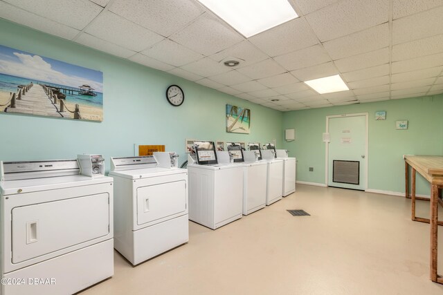 clothes washing area with separate washer and dryer