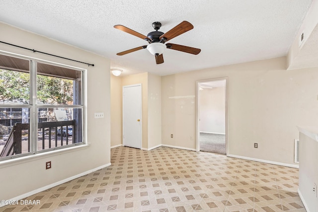 unfurnished room featuring a textured ceiling and ceiling fan