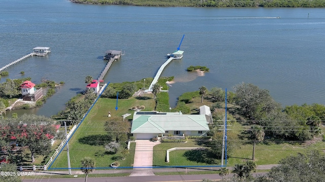 birds eye view of property with a water view