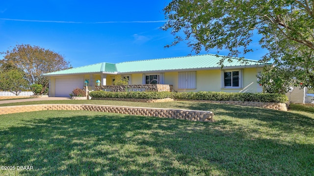 ranch-style home featuring a garage and a front yard