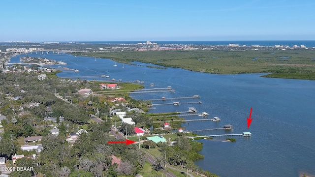 birds eye view of property with a water view