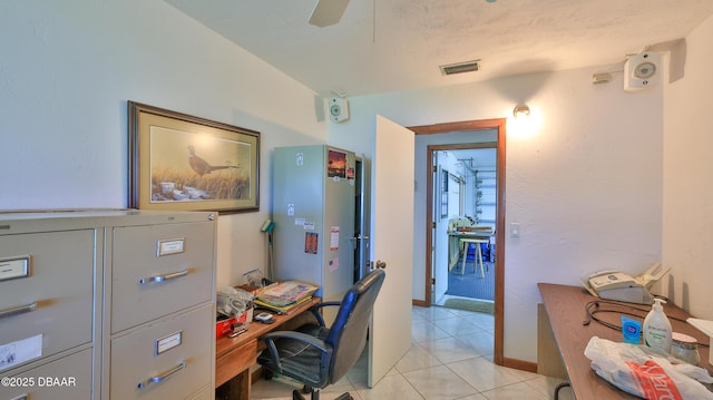 home office with ceiling fan and light tile patterned flooring