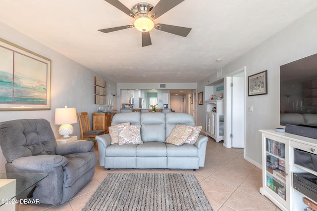 4641 S Atlantic Ave Unit 3060, Ponce Inlet, FL 32127 - living room with light tile patterned flooring and ceiling fan