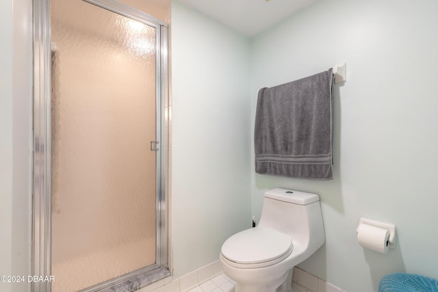 4641 S Atlantic Ave Unit 3060, Ponce Inlet, FL 32127 - full bath with a stall shower, toilet, tile patterned flooring, and baseboards