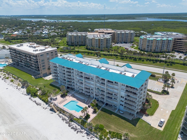 4641 S Atlantic Ave Unit 3060, Ponce Inlet, FL 32127 - bird's eye view of a pool area, a large body of water, and apartment complex
