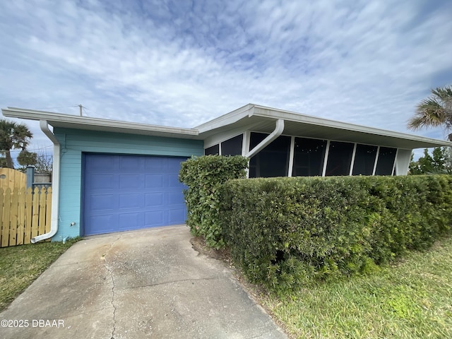 single story home with a garage