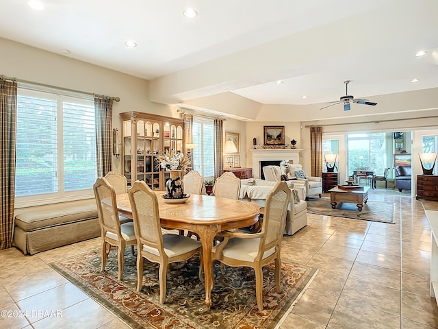 dining space featuring ceiling fan and light tile patterned floors