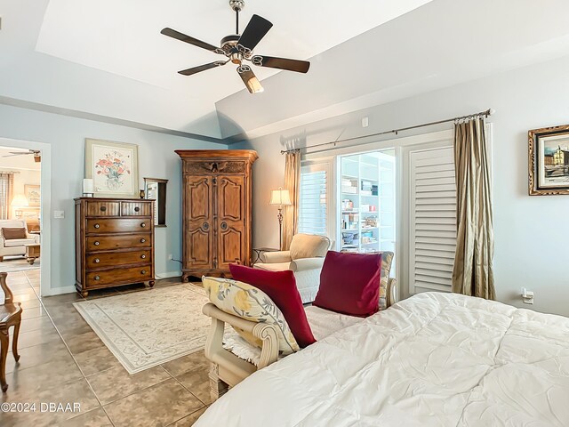 bedroom with ceiling fan and light tile patterned floors