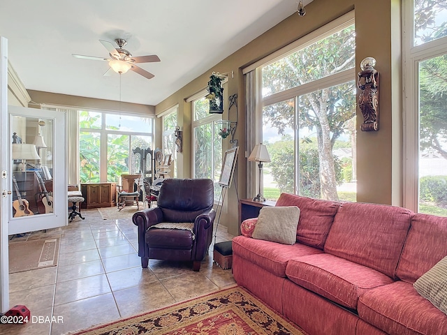 tiled living room with ceiling fan