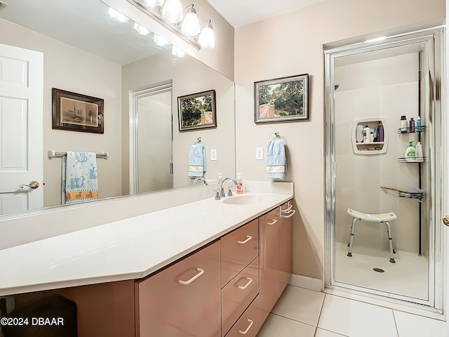 bathroom featuring vanity, tile patterned flooring, and a shower with door